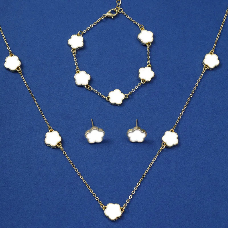 Geometrisches Schmuckset: Halskette, Armband & Ohrringe mit Blumen-Design