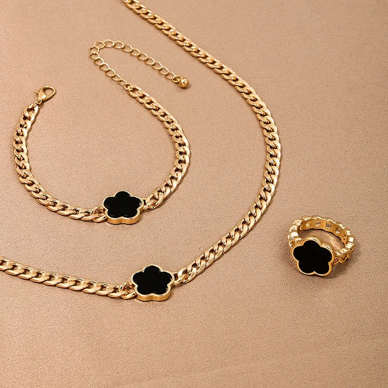 Geometrisches Schmuckset: Halskette, Armband & Ohrringe mit Blumen-Design